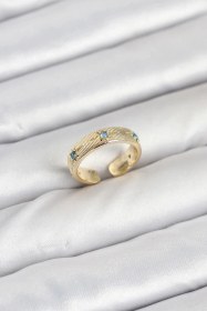 Resim Ceylan Adam Pirinç Gold Renk Mavi Zirkon Taşlı Kutup Yıldızı Model Kadın Yüzük Çok Renkli 