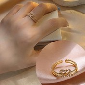 Resim Kadınlar için her gün giyilebilecek mükemmel bir infinite love tasarımı ve mikro-set zirkonya taşları bulunan bir bakır halka. 