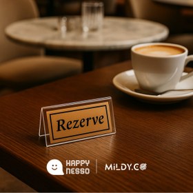 Resim Happynesso Masa Yazısı Serisinden ŞEFFAF Pleksi Üstü TEK Yön BRONZ Metal "REZERVE" Yazısı - 100 mm X 50 mm 