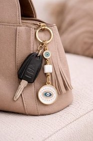 Resim Gold Nazar Boncuklu Anahtarlık - Beyaz Mine & Altın Kaplama Modern Şans Tılsımı - Çanta ve Araba Anahtarı İçin Unisex Premium Tasarım 
