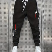 Resim Bu erkekler için dantelli spor pantolonları, tüm mevsimler boyunca rahat ve şık kalmanızı sağlar ve göz alıcı geometrik baskılarıyla dikkat çekir. 