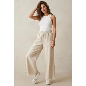 Resim Modestim Kadın Bej Beli Lastik Özel Yıkamalı Kumaş Paçaları Püsküllü Geniş Paça Tesettür Pantolon 