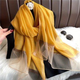Resim Kadınlar için tasarlanmış, güneş koruyucu uzun bir şal, çeşitli renklerde sunulan, hijab ve şal için uygun, çok fonksiyonlu bir şal. 