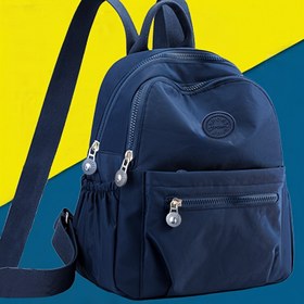 Resim Erkekler ve kadınlar için rahat seyahat ve sokak giyim çantası olan Unisex Deniz Mavisi Sırt Çantası, Ayarlanabilir Askılar, Çoklu Fermuarlı Bölümler ve Dekoratif Püsküller - Günlük Kullanım ve Seyahat İçin Güvenli Fermuar Kapanışı 