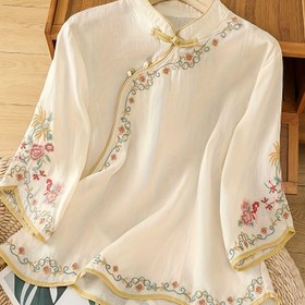 Resim Kadınlar için ilkbahar/yaz/sonbahar için mükemmel olan, floran bezli, üçte bir kollu ve duran yaka ile şık vintage ilhamlı yün bluz. 