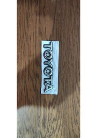 Resim Toyota Ae101 Kasa Bagaj Yazısı Siyah Görünümlü Nikelaj Kaplama 