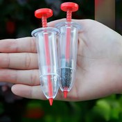Resim Kullanımı kolay taşınabilir tohum dağıtıcısı - Tam tohum manuel ekinleyici, bahçe ve çim bakımında ideal, tek elle çalıştırılabilir, dayanıklı plastik, kırmızı detaylarla şeffaf tasarım 