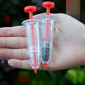 Resim Kullanımı kolay taşınabilir tohum dağıtıcısı - Tam tohum manuel ekinleyici, bahçe ve çim bakımında ideal, tek elle çalıştırılabilir, dayanıklı plastik, kırmızı detaylarla şeffaf tasarım 