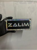 Resim HBSİ SİYAH RENK ÜZERİ HOLOGRAM RENK ZALIM YAZILI VANTUZLU CAM SÜSÜ 