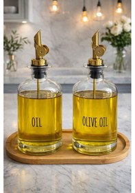 Resim Qerhome Bambu Stantlı 2'li Gold Başlıklı Şeffaf Cam Yağdanlık Seti 500 Ml+500 Ml Oliva Glass Beyaz 