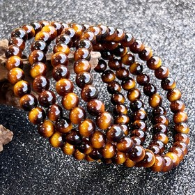 Resim 6/8/10 mm boyutunda dört tigre göz taşı bileziği, şık ve çok yönlü, ayarlanabilir elastik bantlarla, rahat kıyafetler için mükemmel - iyi şans ve refahı simgeler. 