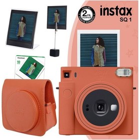 Resim Fujifilm Instax SQ1 Terracotta Fotoğraf Makinesi + 10'lu Kare Film + Deri Kılıf + Pleksi Çerçeve + Kıskaçlı Stand Turuncu 