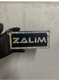 Resim Siyah Renk Üzeri Hologram Renk Zalım Yazılı Vantuzlu Cam Süsü 