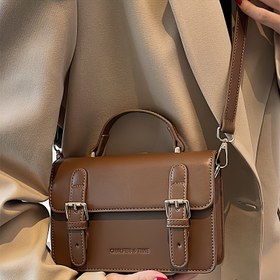Resim Şık Sentetik Deri Kadın Çantası - Ayarlanabilir Askılı Minimalist Crossbody Çanta, Manyetik Kapatma & Metal Toka, Hafif ve Dayanıklı Tasarım, Siyah/Kahverengi Renklerde Geniş Eşya Organizatörü | İş/Seyahat/Gezinti İçin Seyahat Çantası | Parlak Metal Detaylar, Küçük El Çantası 