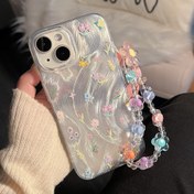 Resim Renkli bir çiçek ve tüy ipliği örneği sunan bir Vizyonlu Çiçek Kolye Zinciri Parçası, iPhone 16 Pro Max ile birlikte 11'den 15'e kadar Pro Max modelleri için tasarlandı. Şık bir cep telefonu kapağı, bir hediye olarak mükemmel. 