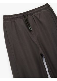 Resim Koton Cepli Beli Lastikli Bağlamalı Loose Fit Jogger Paraşüt Pantolon Antrasit 6wkb40018tw Antrasit 