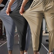 Resim Erkekler için Yüksek Esneklikte Kaygan Lif Spor Pantolonları - Nem Çeken Cepli Antrenman Pantolonu, 3 Renk Seçeneği (Siyah/Gri/Zeytin Yeşili), Yazlık Atletik Dar Kesim, Koşu Pantolonları, Tek Renk Tasarım, Pürüzsüz Dokulu Kumaş 
