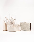 Resim E&L Company Net 15.5cm, Kalın Topuklu. Kırık beyaz, deri. Çantasıyla beraber takımdır. 