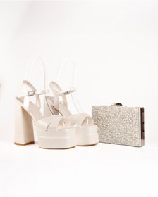 Resim E&L Company Net 15.5cm, Kalın Topuklu. Kırık beyaz, deri. Çantasıyla beraber takımdır. 