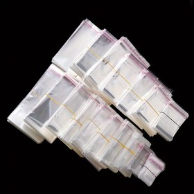 Resim Yüz adet şeffaf kendinden yapışkanlı poşet, OPP poşet, yüzükler, küpeler, bilezikler, kolyeler için plastik saklama poşeti, mücevher sergileme paket poşeti 