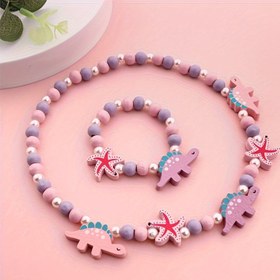 Resim Ahşap Boncuklardan Yapılmış Sevimli Küçük Dino Rainbow Kolye ve Bileklik Dahil Aksesuar Seti, 2 veya 4 Parça Olarak Mevcuttur. 
