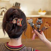 Resim Avrupa ve Amerikan moda trendleri sevimli ve oyunbaz kedi temalı saç taraakları sunuyor ve kadınlara sofistike bir dokunuş sağlıyor. Bu çok yönlü, retro-stil saç aksesuarları updo'lar için stil yapmak için mükemmel. 
