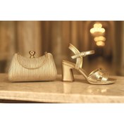 Resim E&L Company 7cm Altın simli kumaş. Çantasıyla birlikte takımdır. Bu ayakkabı koşma Garantilidir. 