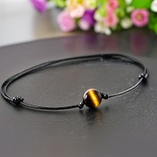 Resim Erkekler ve kadınlar için 8 mm kedi gözü taşından yapılmış ayarlanabilir bir bilezik. 