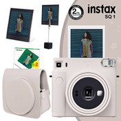 Resim Fujifilm Instax SQ1 Terracotta Turuncu Fotoğraf Makinesi 20'li Kare Film Deri Kılıf Pleksi Çerçeve ve Kıskaçlı Stand Fujifilm