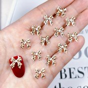 Resim 50 adet Leopar Baskılı Nail Art Studs, Reçine Kelebek Düğme Sihirleri, DIY Tırnak Dekorasyonları, Alkol İçermeyen, Düğün Manikür Aksesuar Seti 