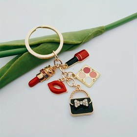 Resim Eyeshadow paleti, ruj, el çantası ve makyaj aksesuarları ile şık bir emaye anahtarlık, bayanlar için mükemmel bir hediye ve erkekler ve kadınlar için uygun el yapımı takı. 