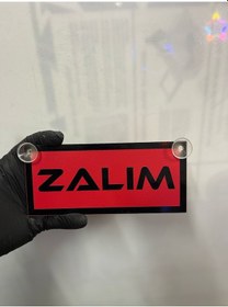 Resim Kırmızı Renk Üzeri Siyah Renk Zalım Yazılı Vantuzlu Cam Süsü 