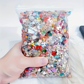 Resim Çeşitli şekillerde, kalp ve kurdele şekilleri de dahil olmak üzere, reçineden yapılmış, düz tabanlı tırnak sanatı taşları için 50 gram (1500-2000 adet) 3D karışık renkli tırnak süslemeleri. 