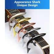 Resim Gitar için şık ve benzersiz metal köpek balığı kapo, çinko alaşımlı akustik gitar kaposu, akordeon fonksiyonlu ve ses değiştirme özelliğine sahip elektrik gitar kaposu. 