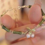 Resim Yeni Çin bambu çan bileklik kadın niş retro peridot bayan rüzgar çanı bileklik 