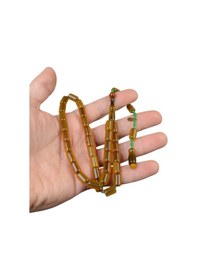 Resim Kesme Kesim 10x7 Mm İmzalı Sıkma Kehribar Sistem Püsküllü Tesbih Sarı 
