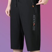 Resim Erkekler için Drawstring ve Fermuarlı Cep Detaylı Yedi Noktalı Spor Pantolonu, Basit ve Şık, Spor, Fitness ve Günlük Kullanım için Uygun 